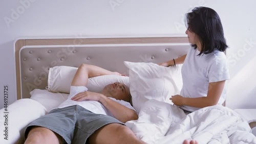 Angry woman annoyed by her snoring husband