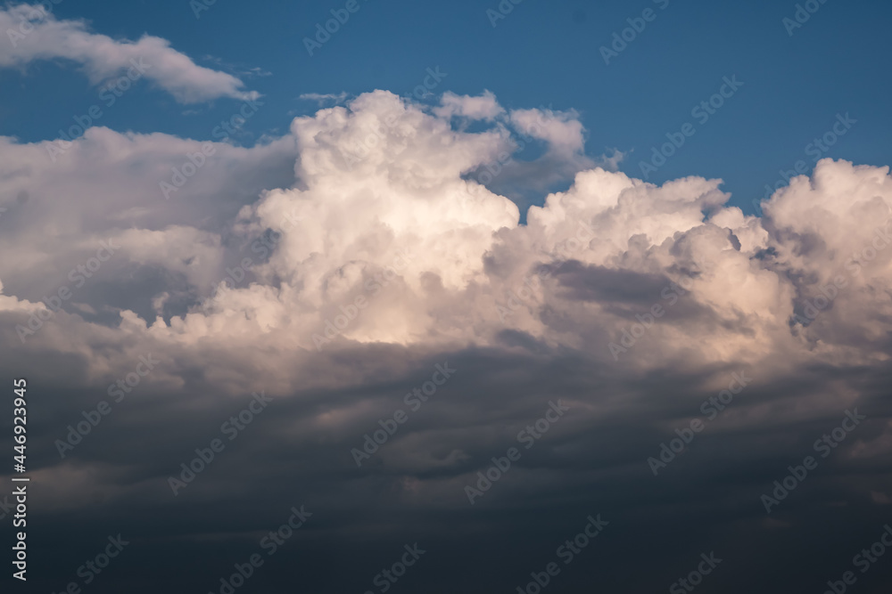 Blue sky background with big white tiny stratus cirrus striped clouds Blue sky background with big white tiny stratus cirrus striped clouds