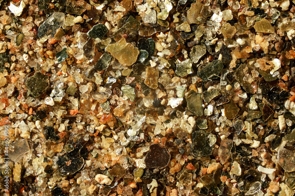 Sea sand (Malindi beach, Kenya) with golden like particles few ocean shell remains visible. 4x magnification microscope photo, image width = 9mm Sea sand (Malindi beach, Kenya) with golden like particles few ocean shell remains visible. 4x magnification microscope photo, image width = 9mm