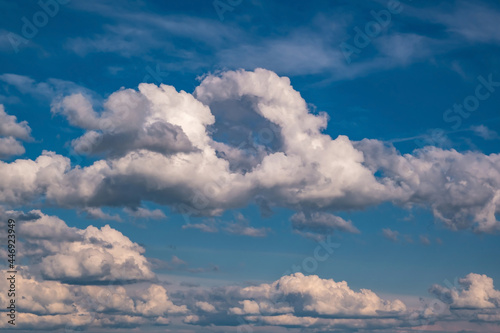 Fototapeta Naklejka Na Ścianę i Meble -  Blue sky background with big white tiny stratus cirrus striped clouds
