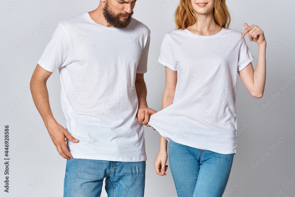 young couple in white t-shirts and jeans Design mockup Copy Space young couple in white t-shirts and jeans Design mockup Copy Space