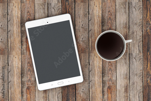 tablet on wooden background