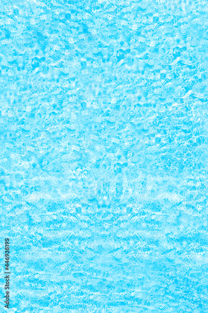 Blue transparent water surface in the swimming pool. Horizontal pool background. Aerial, drone view. Vertical ratio, size