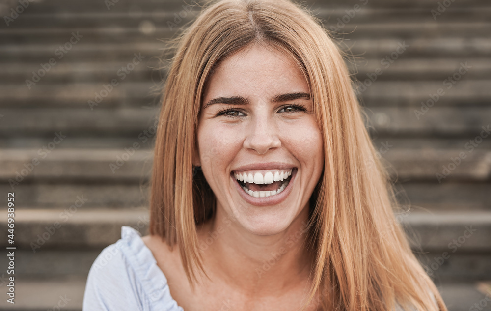 Young caucasian woman smiling on camera outdoor Young caucasian woman smiling on camera outdoor