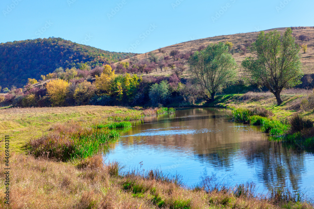 Idyllic valley with river . Awesome nature in September Idyllic valley with river . Awesome nature in September