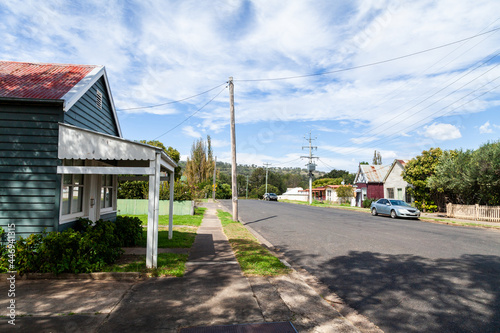Main street of tiny rural country town in Australia with old buildings and one parked car photo