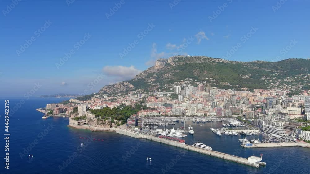 Monte Carlo, Monaco. Aerial view of famous city towering over Mediterranean Sea, yachts and boats in marina Port Hercules in La Condamine - landscape panorama of Europe from above Monte Carlo, Monaco. Aerial view of famous city towering over Mediterranean Sea, yachts and boats in marina Port Hercules in La Condamine - landscape panorama of Europe from above