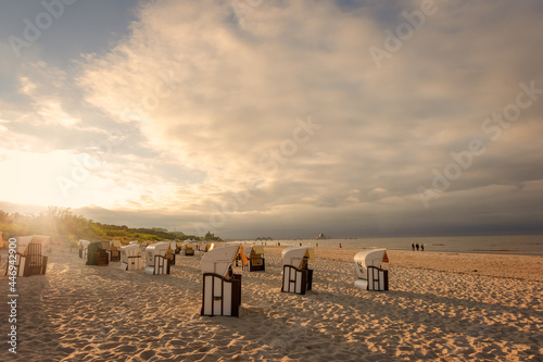 Fototapeta Naklejka Na Ścianę i Meble -  Beach chairs in the evening sun on the beach of Ahlbeck on the Baltic Sea.