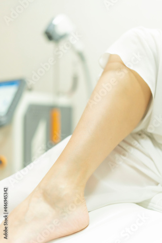 A woman gets laser hair removal on her leg