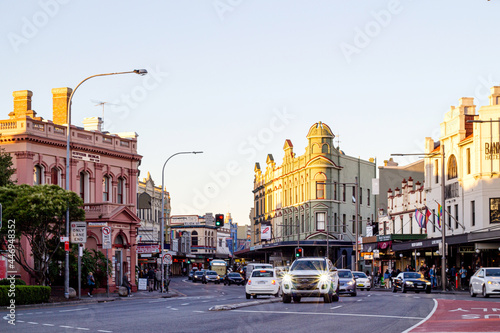 Horizontal shot of Newtown's street with buildings and cars photo