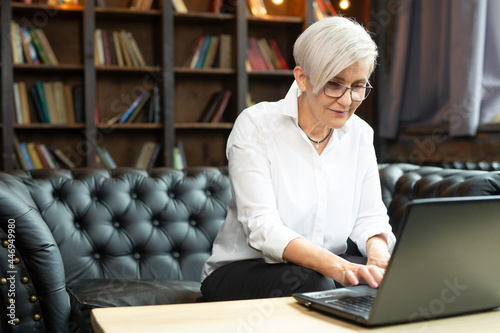 adult woman working with laptop in office  photo