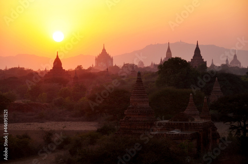 View landscape with silhouette chedi stupa of Bagan or Pagan ancient city and UNESCO World Heritage Site with over 2000 pagodas and temples evening twilight dusk time in Mandalay of Myanmar or Burma © tuayai
