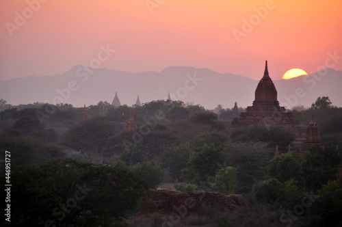 View landscape with silhouette chedi stupa of Bagan or Pagan ancient city and UNESCO World Heritage Site with over 2000 pagodas and temples evening twilight dusk time in Mandalay of Myanmar or Burma