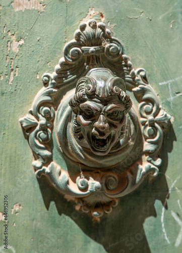 old bell button at houses in Venice, symbolizing a shouting antiqoe man © travelview