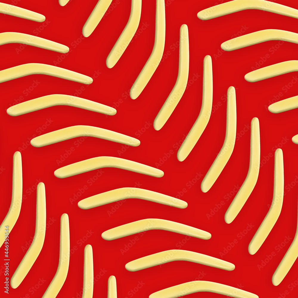 Yellow boomerangs on red background, flat lay Yellow boomerangs on red background, flat lay