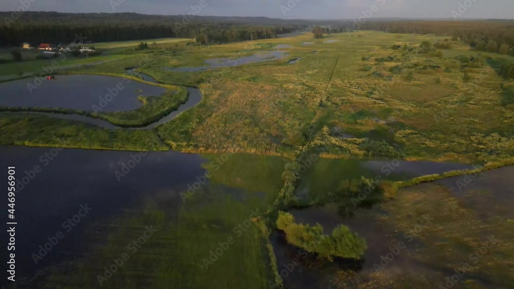 A bired's-eye view of the river and the Supraśl reservoir at sunset.A top viewe of the orthodoxmale manastery in Supraśl A bired's-eye view of the river and the Supraśl reservoir at sunset.A top viewe of the orthodoxmale manastery in Supraśl