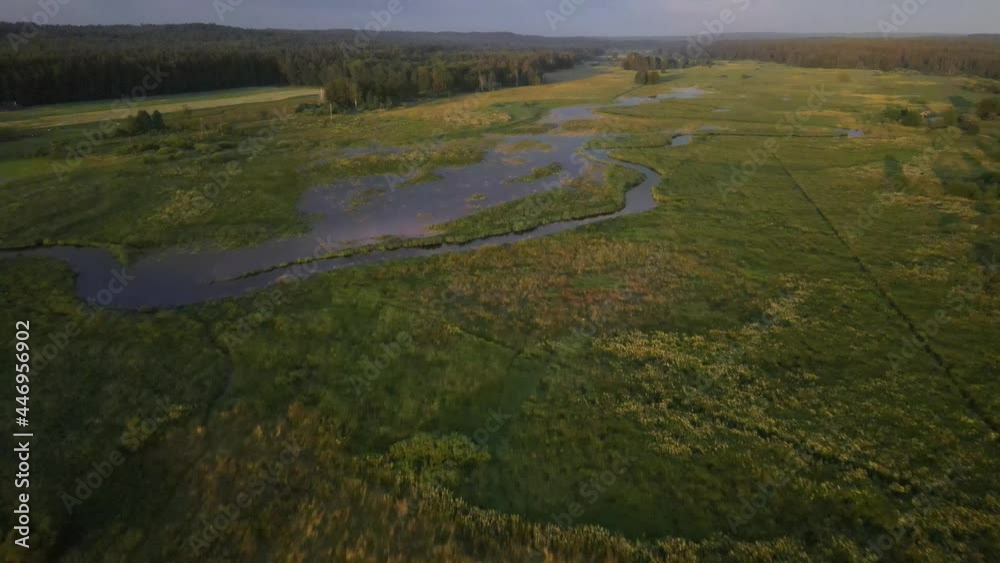 A bired's-eye view of the river and the Supraśl reservoir at sunset.A top viewe of the orthodoxmale manastery in Supraśl A bired's-eye view of the river and the Supraśl reservoir at sunset.A top viewe of the orthodoxmale manastery in Supraśl