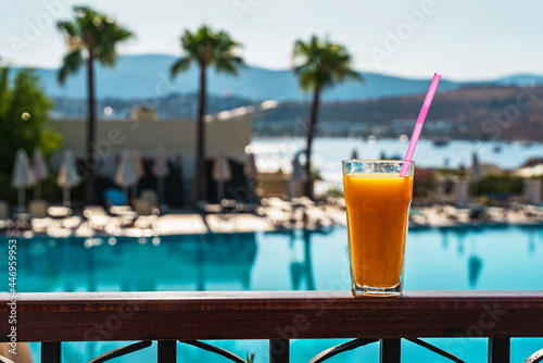 cocktail on the beach. glass of freshly squeezed orange juice. Orange fresh . Summer and healthy food concept