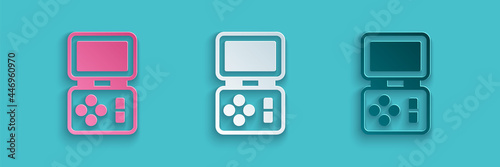 Paper cut Portable tetris electronic game icon isolated on blue background. Vintage style pocket brick game. Interactive playing device. Paper art style. Vector