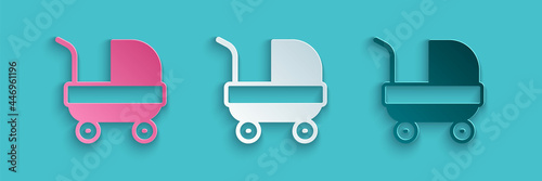 Paper cut Baby stroller icon isolated on blue background. Baby carriage, buggy, pram, stroller, wheel. Paper art style. Vector