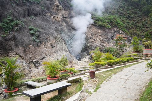 sulfur fumes coming out of between the rocks on the slopes of the mountain