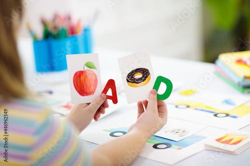 Kid learning to read. Phonics flash cards. photo