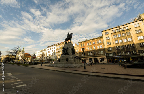 Fototapeta Naklejka Na Ścianę i Meble -  Krakow, Poland : Wide angle shot of Grunwald Monument, an equestrian statue of King of Poland located at Matejko Square against cloudy sky