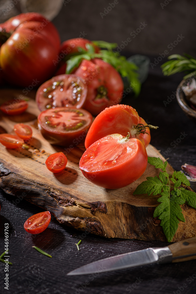 Tomatoes on rustic kitchen counter Tomatoes on rustic kitchen counter