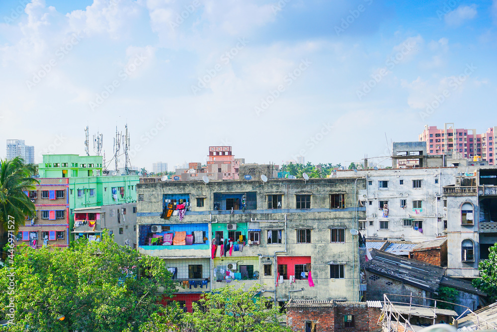 Modern and old architecture of buildings, blue sky and white clouds in background. Kolkata, West Bengal, India.