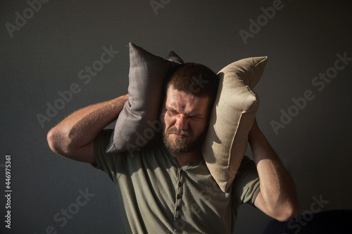 concept of headache, fear of noise