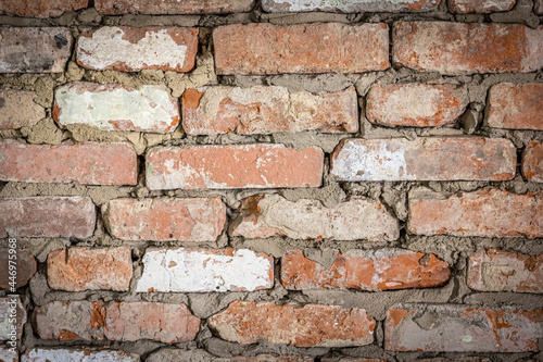 Old brick textured wall, shabby building facade.