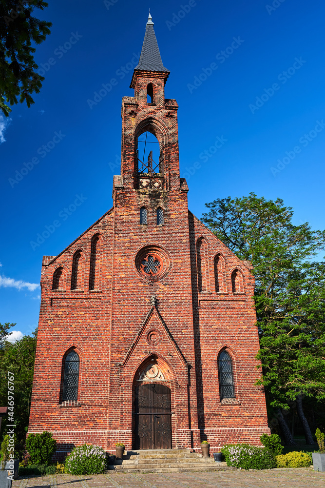 Rural, post-Evangelical church with a red brick bell towe