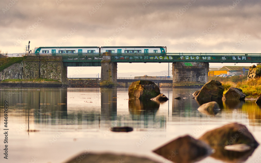 Train crossing bridge over the Lough Atalia in Galway city, Ireland
