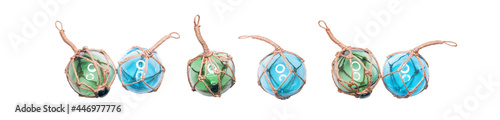Glass fishing round buoys. Many of glass spheres with ropes isolated on white background.