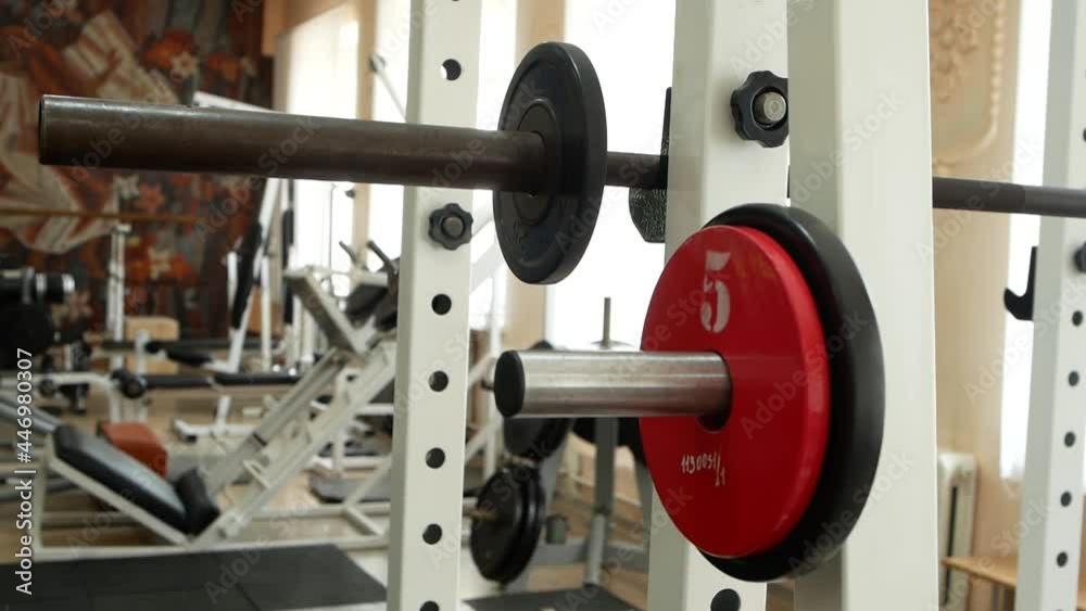 Close up of extra weights for the barbell. Weight plate for barbell in the gym. Close up of extra weights for the barbell. Weight plate for barbell in the gym.