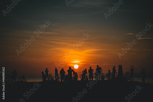 silhouette of a group of people at sunrise