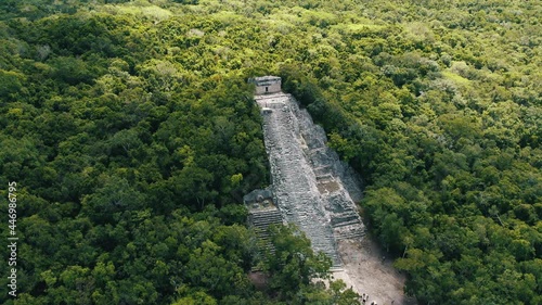 Aerial view of Ancient Mayan pyramid and Coba ruins in Mexico. Landscape panorama of Quintana Roo Peninsula from aboveL. Lush jungle on a sunny day, 4k UHD. photo