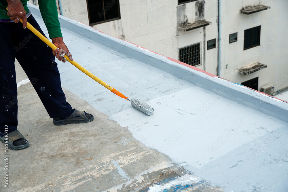 Hand painted gray flooring with paint rollers for waterproof, reinforcing net,Repairing waterproofing deck flooring.