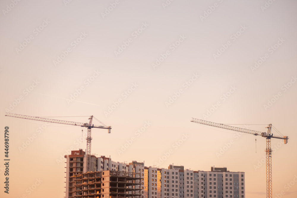 Construction crane and a building house Construction crane and a building house