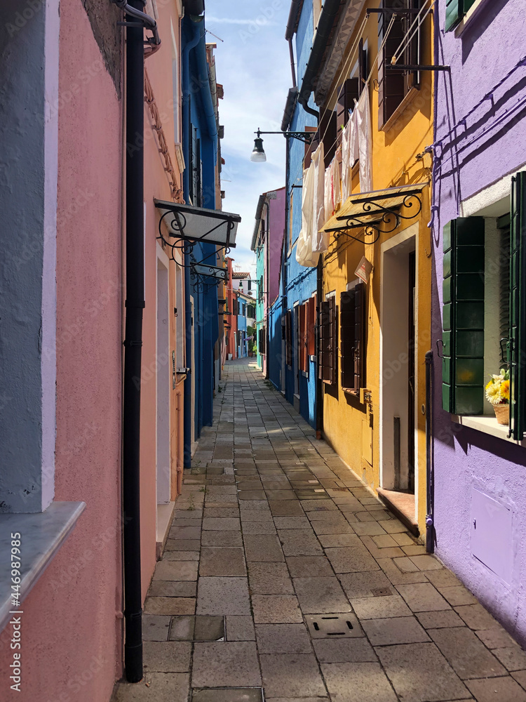 scenic narrow colorful houses at the venetian island of Burano