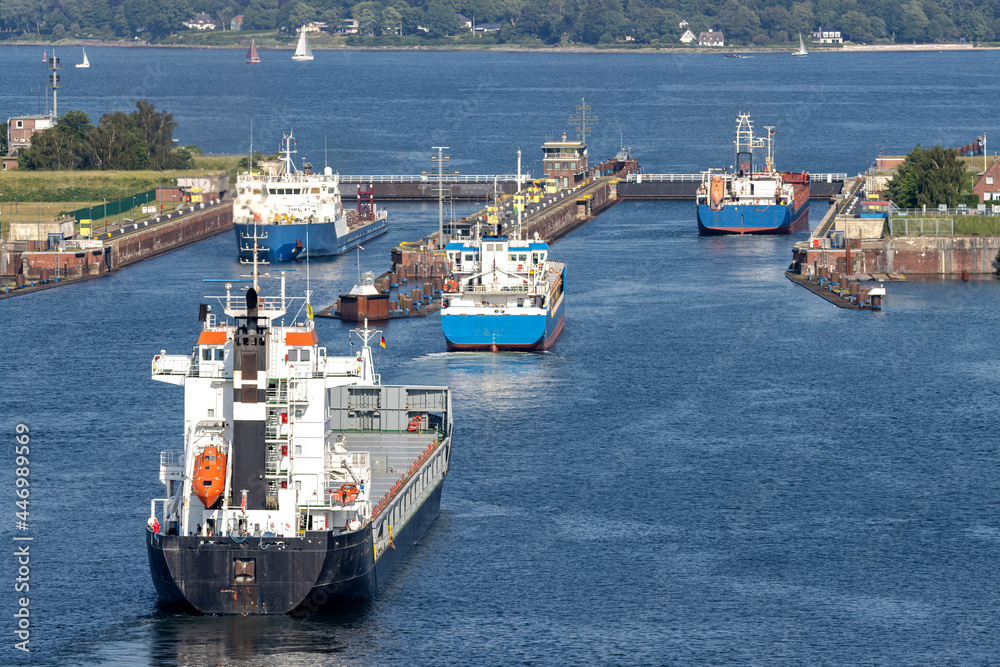 ships in the Kiel canal with Holtenau Locks in the background