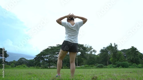 New normal sport outdoor, young Asian chubby woman stretching her body warm up before workout outdoor. photo