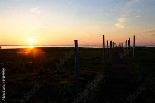 Summer sunrise over the sea in Latvia near the pier.