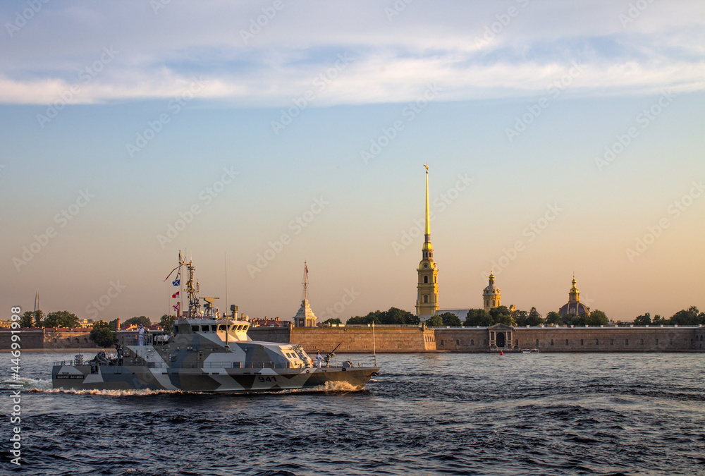 St. Petersburg, RUSSIA-July, 15, 2021: rehearsal of the parade on the Neva River in the early morning at dawn - a warship sails near the Peter and Paul Fortress