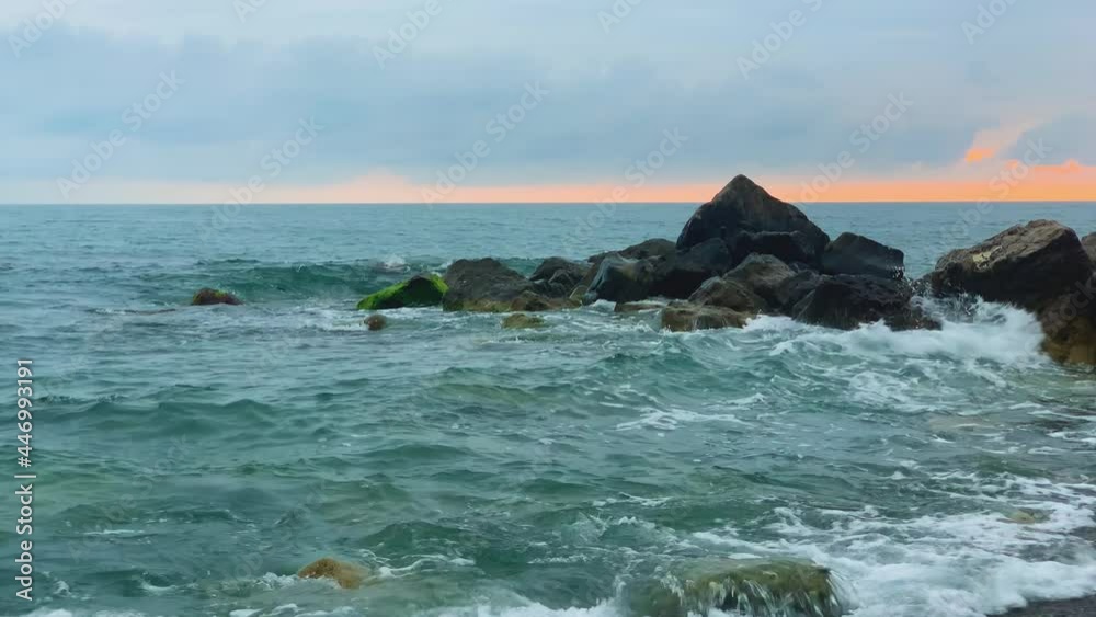 Nice view of the surf at sunset. Landscape and nature of the Black Sea coast
Nice view of the surf at sunset. Landscape and nature of the Black Sea coast
