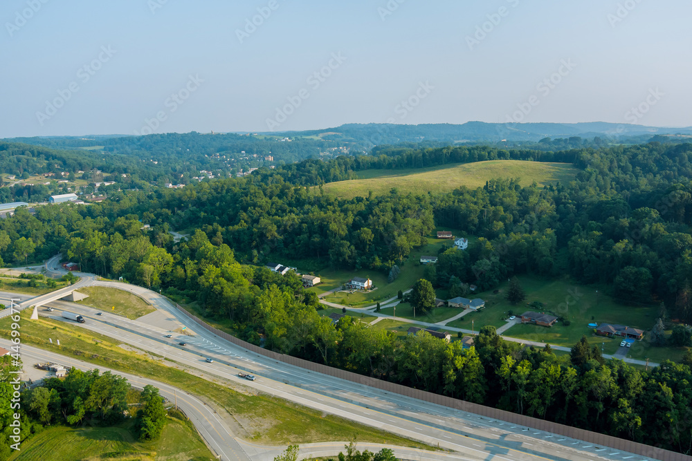 Panoramic view of Dwight D. Eisenhower highway 70 road near small Bentleyville town hills the farm meadow in Pennsylvania, US