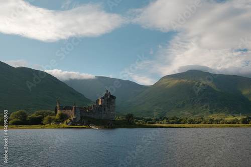 Castle ruins on a lake. Kilchurn Castle on Loch Awe in summer in the Scottish Highlands