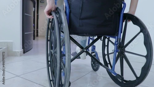 one person in a wheelchair in a corridor