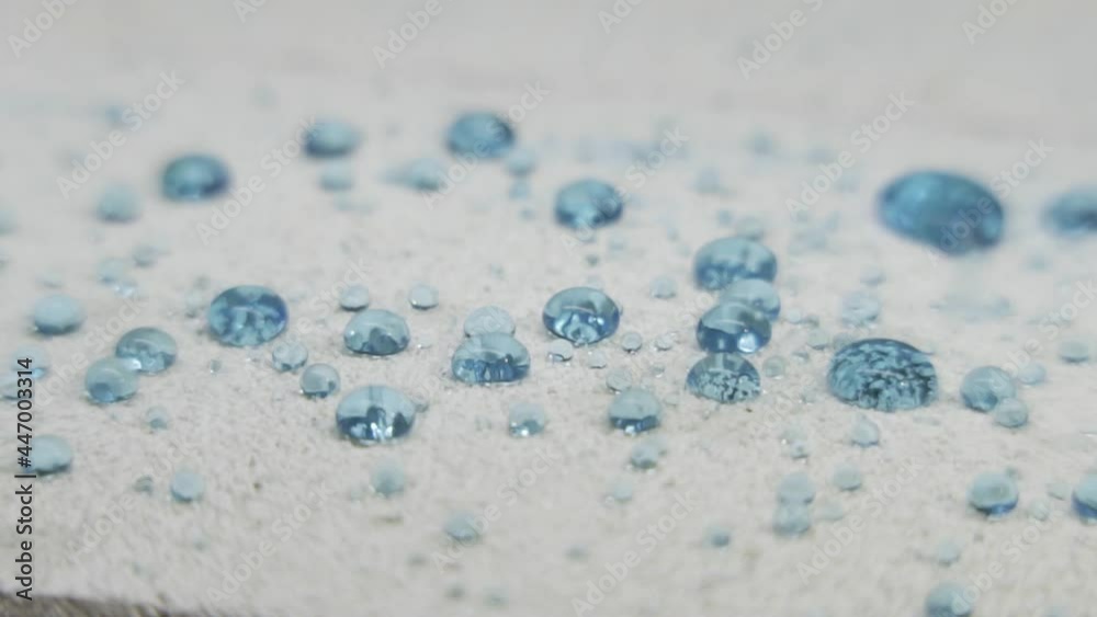 hydrophobic white plastic surface with water droplets