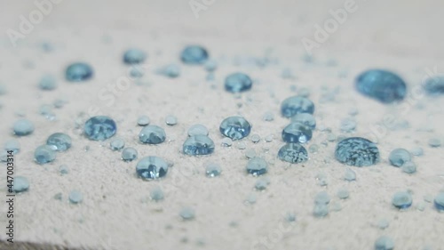 hydrophobic white plastic surface with water droplets photo